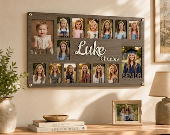 May include: A rectangular dark wood photo collage frame featuring the name Luke Charles in white script. The frame displays thirteen individual portraits of a child from preschool through senior year, with labels for each grade level from PreK to 12.