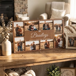 May include: A rectangular wooden collage picture frame featuring seven photo slots. The centre panel is engraved with the text "The Bradleys" and "EST. 2012". The frame has a dark wood grain finish and is secured with small silver-toned metal fasteners.