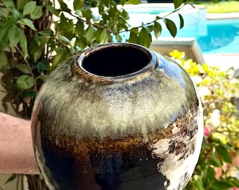 Handmade ceramic vase, mottled blue glaze over black glaze