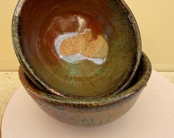 Pair of small ceramic trinket or mise en place bowls, green and brown glazes