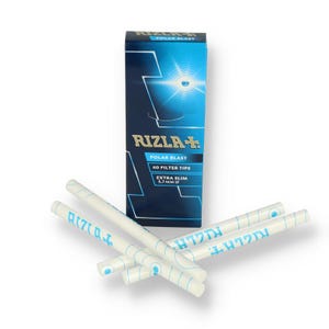 May include: A blue and white box of Rizla+ Polar Blast filter tips with the text "Polar Blast" and "Extra Slim 5.7 mm O". Several white filter tips with blue text are scattered in front of the box.