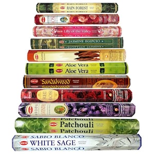 May include: A selection of HEM incense sticks, featuring scents such as Rain Forest, Rose, Lily of the Valley, Jasmine, Aloe Vera, Sandalwood, Red Rose, Lavender, Patchouli, and White Sage. The sticks are in patterned packaging.
