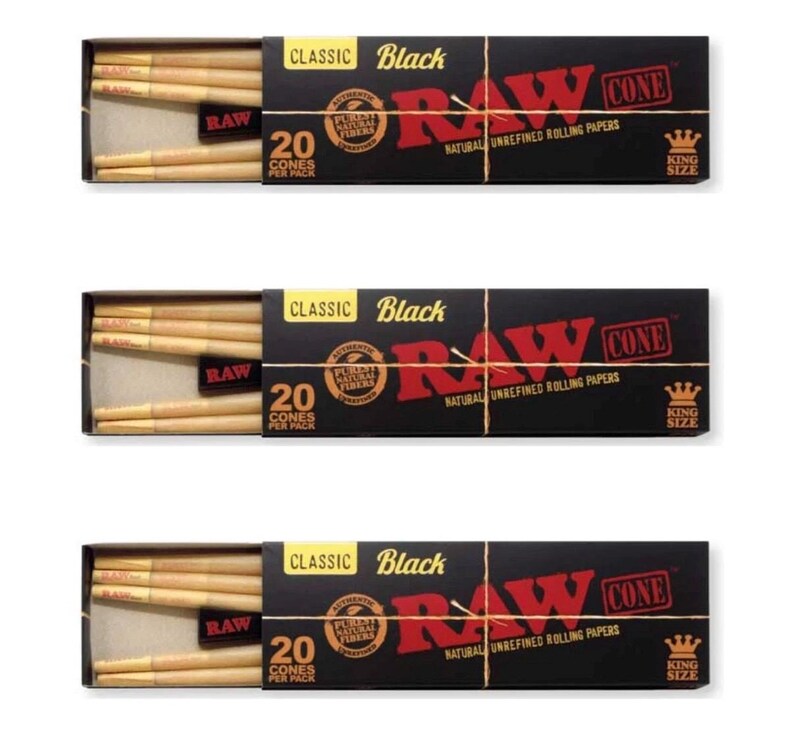 May include: Three identical black rectangular boxes of RAW Classic Black King Size cones, each containing 20 pre-rolled natural unrefined rolling paper cones. The packaging features red and gold text with the RAW logo and a crown icon.