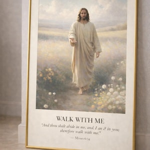 May include: Framed art print featuring a painting of a figure in a white robe extending a hand. The artwork is set in a field with text that reads "WALK WITH ME" and a quote from Moses 6:34. The frame is gold.