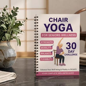 May include: A spiral-bound book titled Chair Yoga for Seniors Wellness 30 Day Challenge. The cover features purple and pink text, a graphic of a person sitting on a chair performing a stretch, and lists strength, mobility, balance, and flexibility.