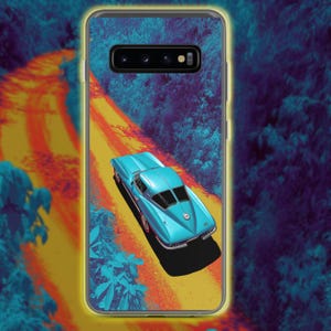 May include: A phone case with a light blue vintage car on a yellow road through a forest. The case has a clear border and a vibrant, stylized design. The car is a classic model.