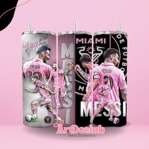 May include: Three stainless steel tumblers with images of a soccer player in a pink uniform. The tumblers have a pink and white background with the words "Goat", "Miami", and "De Futbo". The tumblers have a straw.