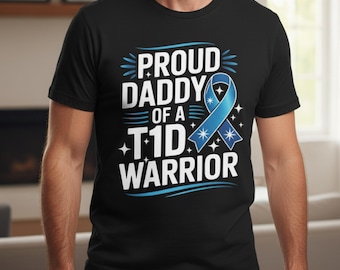 May include: Black t-shirt with the text "PROUD DADDY OF A T1D WARRIOR" in white and light blue. A light blue ribbon graphic is also featured on the shirt. The shirt is a crew neck.