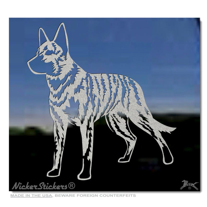 May include: A silver vinyl decal of a standing dog silhouette. The dog is a breed known as a  "Carolina Dog" and is a type of wild dog. The decal is made in the USA and has the text "Nicker Stickers" on the bottom.