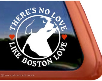 May include: White vinyl sticker with a black and white silhouette of a Boston Terrier dog inside a circle. The text around the circle reads "There's no love like Boston love" with two red hearts on either side of the circle.