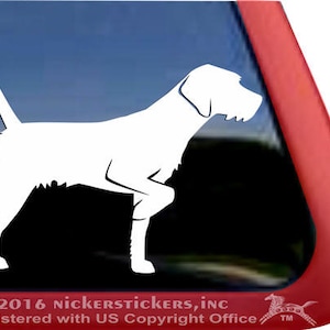 May include: White silhouette of a German Shorthaired Pointer dog standing on all four legs. The dog is facing to the left. The silhouette is on a black background.