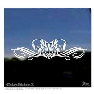 May include: White vinyl decal featuring two stylized horse heads facing each other, with flowing mane details and an ornate, swirling design. The decal is set against a blurred background of blue and black.