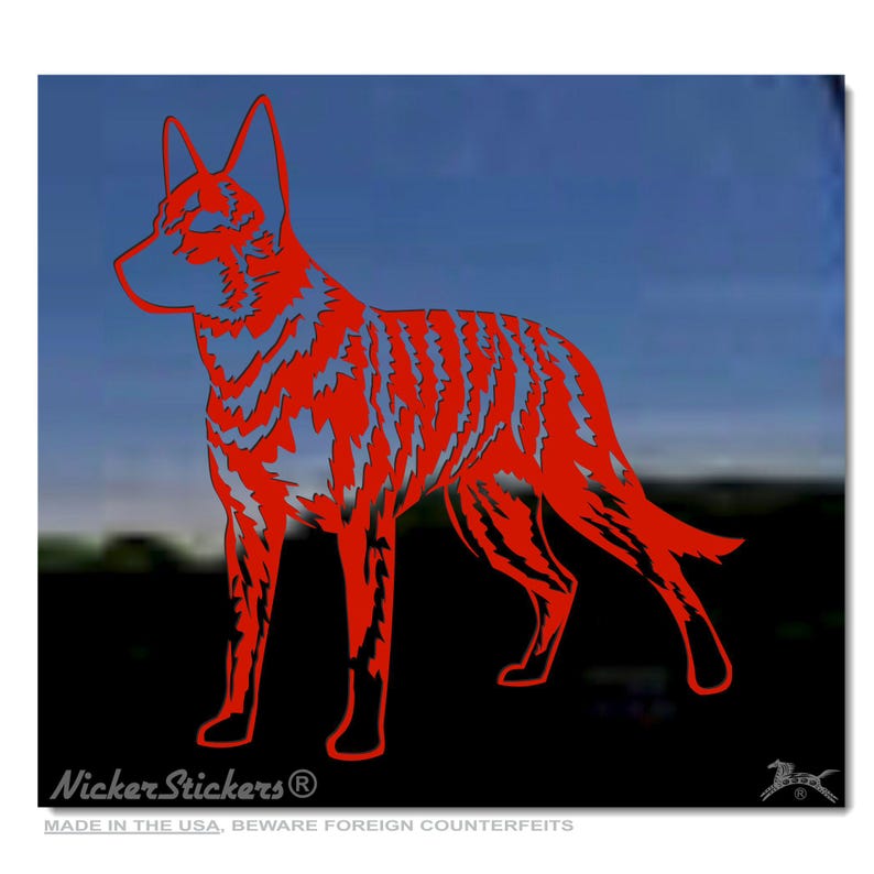 May include: Red silhouette of a dog, possibly a Dingo, standing on a black background. The silhouette is detailed with a textured pattern. The image includes the text "Nicker Stickers" and "Made in the USA. Beware foreign counterfeits."