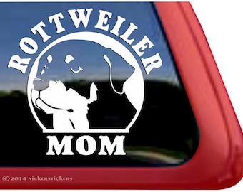 May include: White vinyl decal with a silhouette of a Rottweiler dog's head and the text "Rottweiler Mom".
