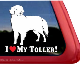 May include: White silhouette of a dog with the text "I love my Toller!" and a red heart.