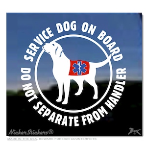 May include: White sticker with a black outline and white text that reads "Service Dog On Board Do Not Separate From Handler". A white silhouette of a dog wearing a red vest with a blue and white medical symbol is in the centre of the sticker.