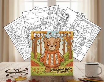 Pode incluir: Um livro para colorir intitulado "Cozy & Comfy" com um urso de desenho animado com um suéter laranja, rodeado por folhas de outono. O livro é exibido com várias páginas para colorir e uma caneca em uma mesa de madeira. Óculos e lápis também estão na mesa.