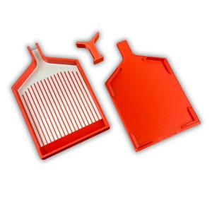 May include: Three-piece orange plastic craft tool set. The set includes a tray with a slotted interior, a solid tray, and a small Y-shaped tool. The trays have handles for easy use.