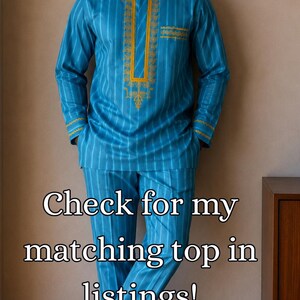 May include: A bright blue long-sleeved tunic and matching trousers set featuring vertical white stripes and gold embroidery around the neckline, cuffs, and pocket. The outfit includes a matching blue cap and brown sandals. Text reads: Check for my matching top in listings!