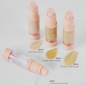 May include: Cosmetic product display featuring four beige-colored primer bottles and three swatches of different shades. The bottles are labeled "Natural Canvas Primer" and the swatches are labeled with color names and numbers.