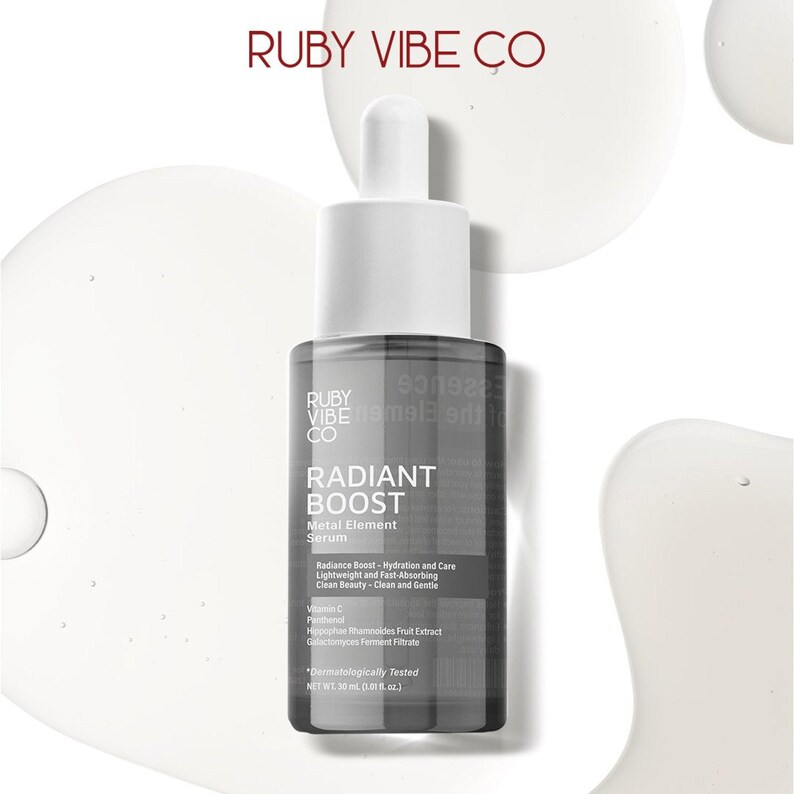 Ruby Vibe Co Radiant Boost Serum bottle on creamy texture background, highlighting hydrating and illuminating formula.