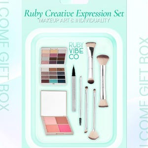 May include: A Ruby Creative Expression Set in a teal gift box. The set includes eyeshadow palettes, blush, eyeliner, and makeup brushes. The text on the box reads "MAKEUP ART & INDIVIDUALITY" and "RUBY VIBE CO."