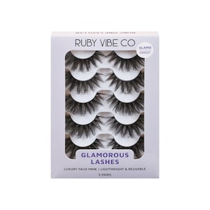 May include: A white box of Ruby Vibe Co Glamorous Lashes. The box contains five pairs of black, faux mink eyelashes. The text on the box reads "Luxury Faux Mink | Lightweight & Reusable" and "5 Pairs".