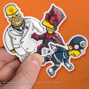 May include: Three cartoon stickers featuring characters from the Simpsons dressed as superheroes. The stickers are printed on white vinyl and feature a yellow, red, and blue color scheme. The stickers are approximately 2 to 3 inches in size.