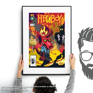 May include: A comic book cover featuring a red, cartoon devil character with a crown and a blue shirt. The character is standing in a fiery landscape with a sign that reads "Welcome to Heck". The comic book title is "Heckboy".