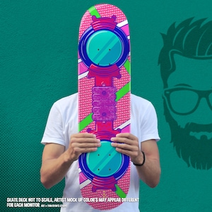 May include: A pink and green skateboard deck with a futuristic design. The deck features a large, circular, blue and white graphic with a smaller, circular, blue and white graphic below it. The deck also has a purple and red graphic in the center.