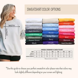 May include: A woman wearing a white crewneck sweatshirt. The image displays a color chart with various sweatshirt colors, including white, black, and orange. A size chart is also included, with measurements in inches for width, length, and sleeve length.