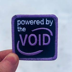 Powered by Void Patch • Cosmic Horror Dark Fantasy Iron-On Badge
