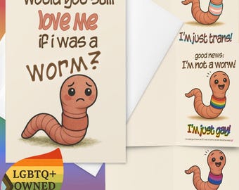 May include: A greeting card featuring a cartoon worm with a sad expression and the text Would you still love me if i was a worm? Other cards show happy worms with pride flag bands and text including I'm just trans, I'm just gay, and I'm just bisexual.