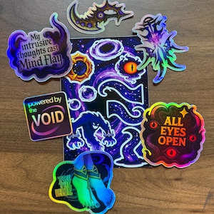 May include: A collection of holographic stickers featuring dark fantasy themes, including text that reads My intrusive thoughts cast Mind Flay, powered by the VOID, ALL EYES OPEN, and Toe the LINE, alongside illustrations of eyes, creatures, and cosmic swirls.