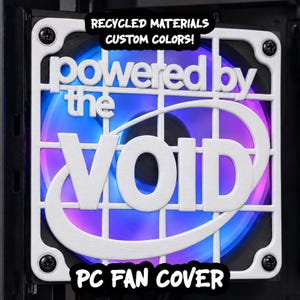 May include: A white square PC fan cover featuring a grid design and the text "powered by the VOID" in raised lettering. The cover is mounted with four black screws over a computer fan that emits a glowing blue and purple light from behind.