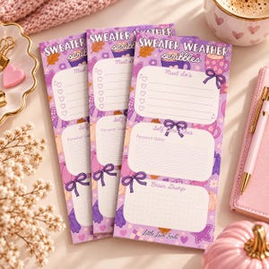 May include: Three identical vertical paper planners with a purple background, featuring the text "SWEATER WEATHER scribbles" at the top. Each planner includes sections labeled "Must do's," "Self Care Vibes," "Personal Goals," and "Brain Dump."