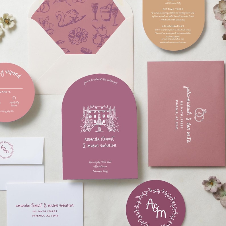 May include: A wedding stationery set in shades of mauve and tan, featuring an arched invitation with a white line drawing of a villa, a circular response card, envelopes with patterned liners, and cards with white text including names and addresses.