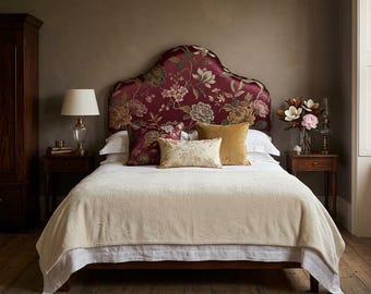 Upholstered silk headboard with floral motifs.