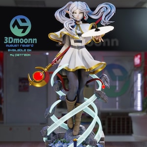 May include: A detailed figurine of a female character with white hair and a white and gold outfit, holding a staff and a disc. The base features blue flowers and a sword. Text on the image reads "3Dmoonnn August Reward available on my Patreon".