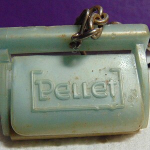 May include: A light blue plastic key chain with a metal chain and the word "Pellet" embossed on the front.