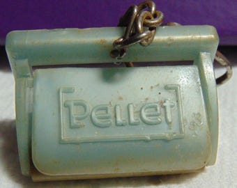 May include: A light blue plastic key chain with a metal chain and the word "Pellet" embossed on the front.