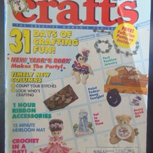 May include: A magazine cover for Crafts magazine, featuring a calendar with 31 days of crafting fun. The cover features a variety of crafts, including a crocheted doll, a painted wooden sign, and a beaded necklace. The magazine cover also includes the text "31 Days of Crafting Fun!" and "New Year's Baby Makes the Party!"