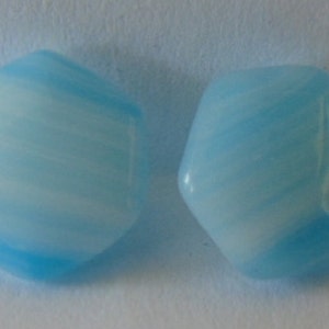 May include: Two blue and white swirled glass hexagon shaped beads.