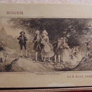 May include: A vintage postcard with a black and white image of a group of people walking in a forest. The text "ROGER" is printed at the top of the postcard. The date "Le 8 Avril 1928" is printed at the bottom of the postcard.