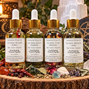 May include: Four clear glass dropper bottles labeled Elemental Ritual Oil, each containing 1 fl oz (30 mL) of liquid with botanical inclusions. The labels read Sacred Flame-Fire, Sacred Root-Earth, Sacred Tide-Water, and Sacred Breath-Air.