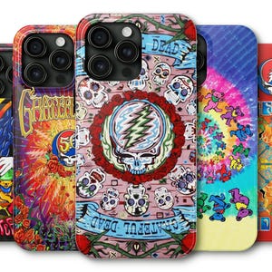 May include: A collection of five phone cases with vibrant, colorful designs. The cases feature Grateful Dead imagery, including skulls, roses, dancing bears, and tie-dye patterns. Each case has a unique design, with the words "Grateful Dead" visible on some.