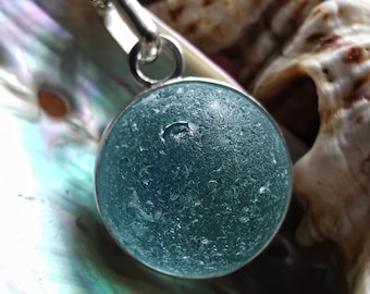 Light blue sea glass marble & sterling silver pendant.