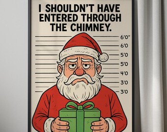Op de afbeelding: Een ingelijste prent met een cartoon kerstman in een politiefoto. De kerstman draagt een rood pak en hoed, en houdt een groen cadeau vast. De tekst luidt: "I SHOULDN'T HAVE ENTERED THROUGH THE CHIMNEY."
