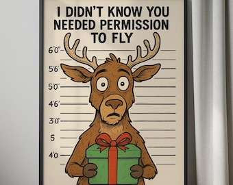 Op de afbeelding: Een ingelijste print met een geschrokken cartoon eland, die een groene geschenkdoos met een rode strik vasthoudt. De tekst erboven luidt "I DIDN'T KNOW YOU NEEDED PERMISSION TO FLY". De achtergrond heeft hoogtemarkeringen.