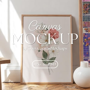 May include: A vertical rectangular wooden frame containing a floral illustration with pink and white flowers and green leaves on a light background. The text Canvas MOCK UP by CozyCanvasMockups JPG & PSD is overlaid on the center of the frame.